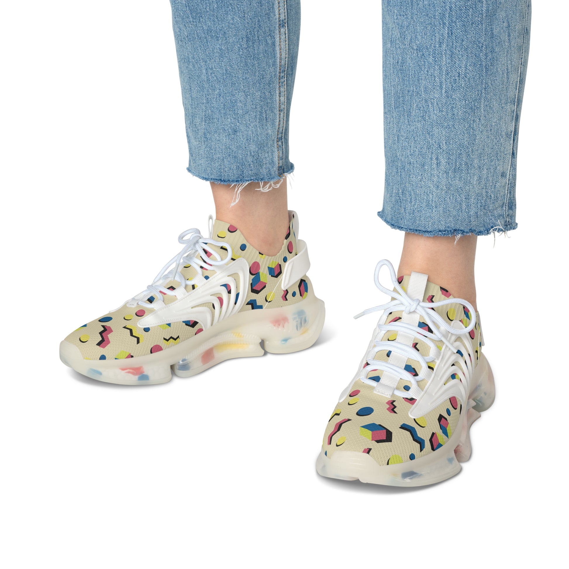 Geometric print sneakers with white laces and chunky sole, worn with blue jeans