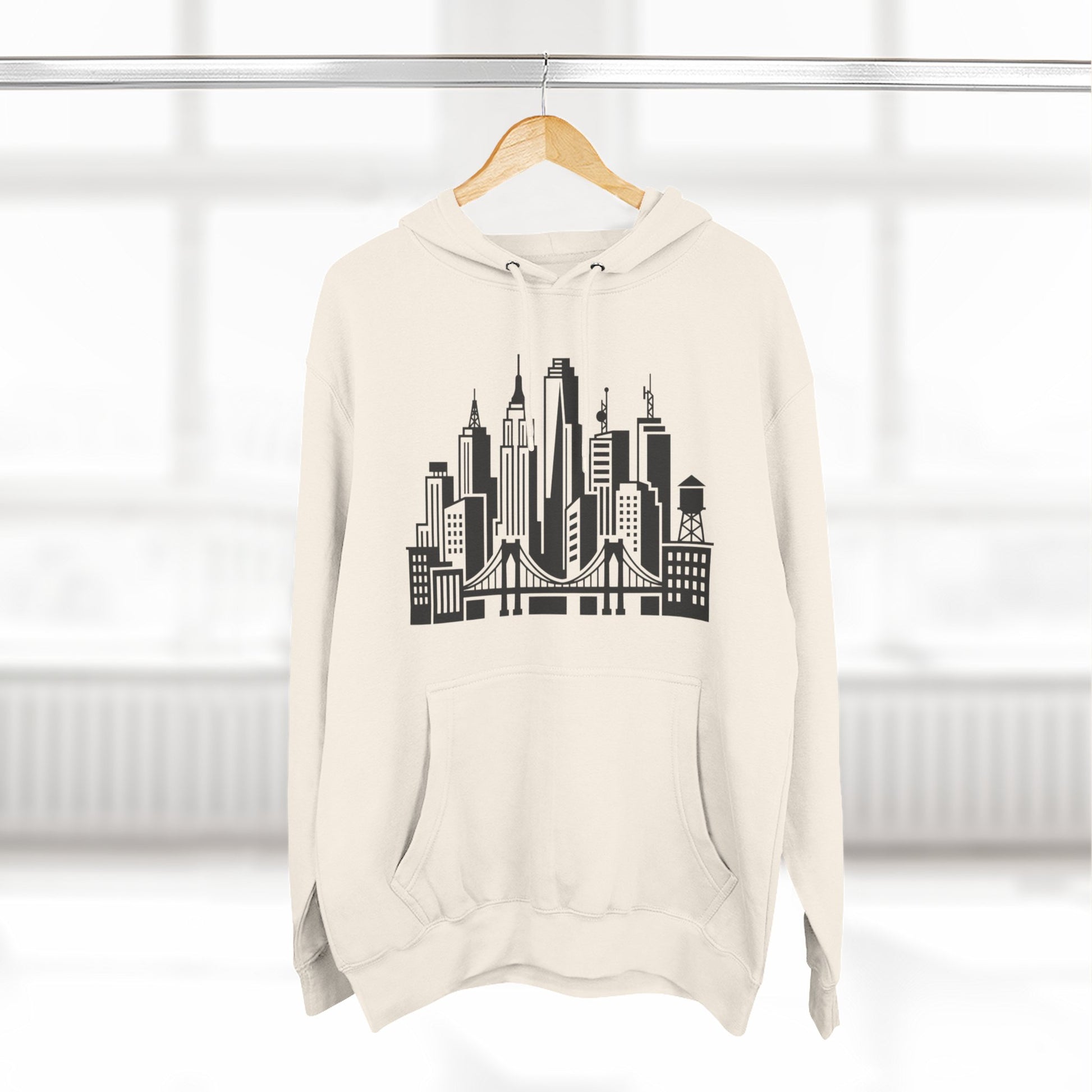 White unisex hoodie on hanger with large city skyline and bridge graphic