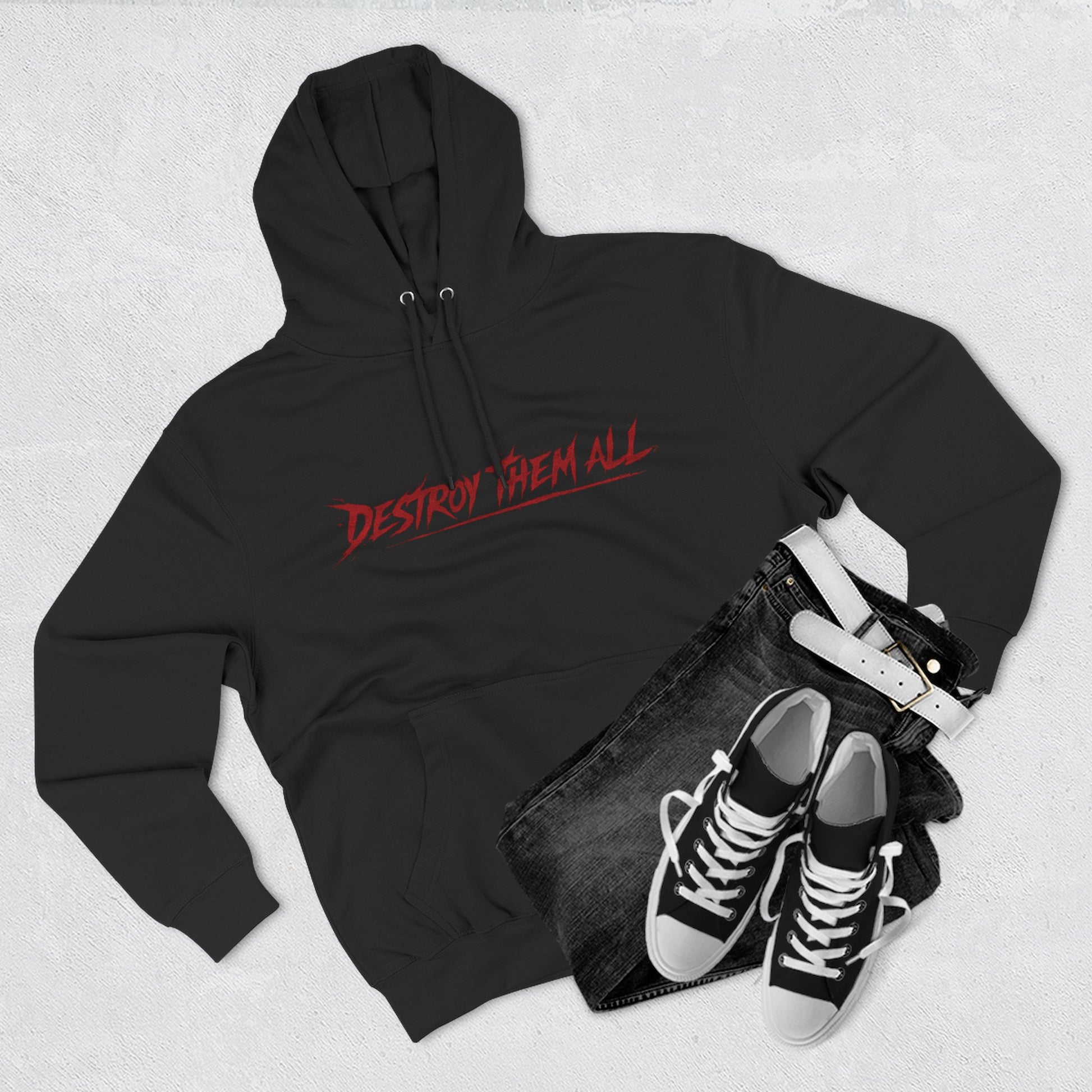 Black unisex hoodie with red logo, front hood and kangaroo pocket, flat lay with shoes