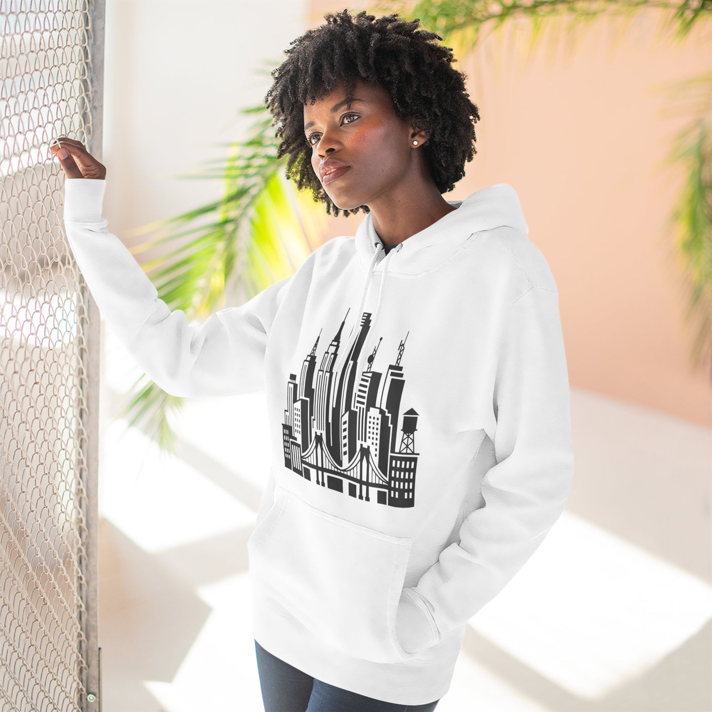 White unisex pullover hoodie with front city skyline and bridge graphic