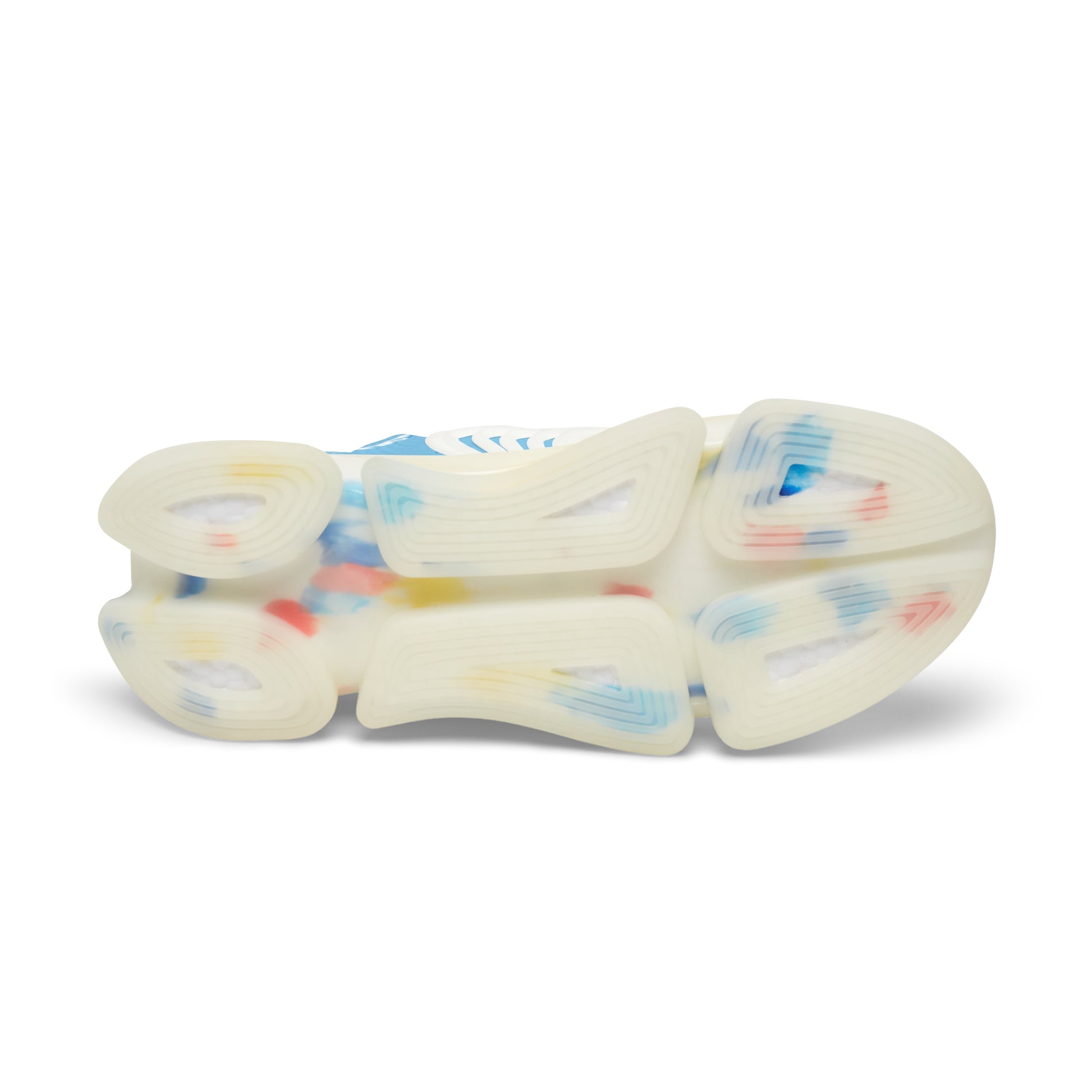 Shoe outsoles of light blue mesh sneakers with thick cream tread and blue speckle.