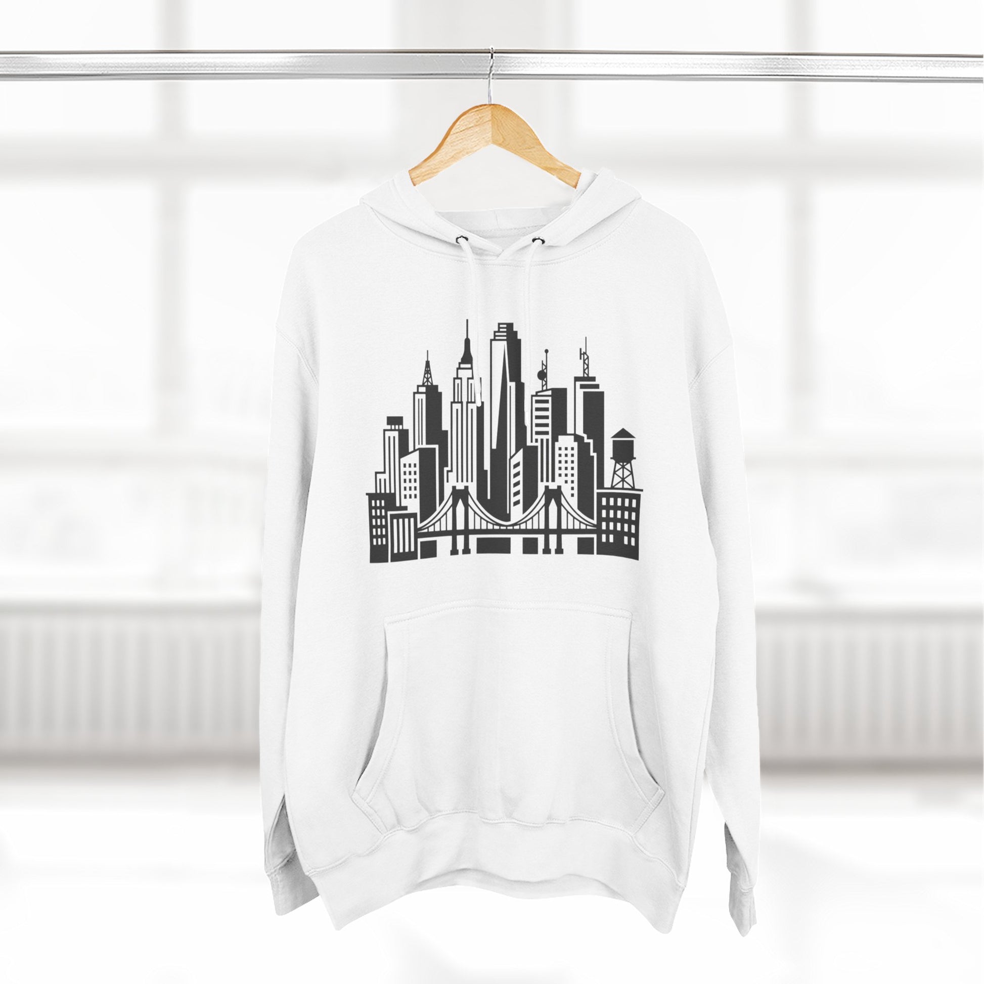 White unisex pullover hoodie with city skyline and bridge graphic on front pouch