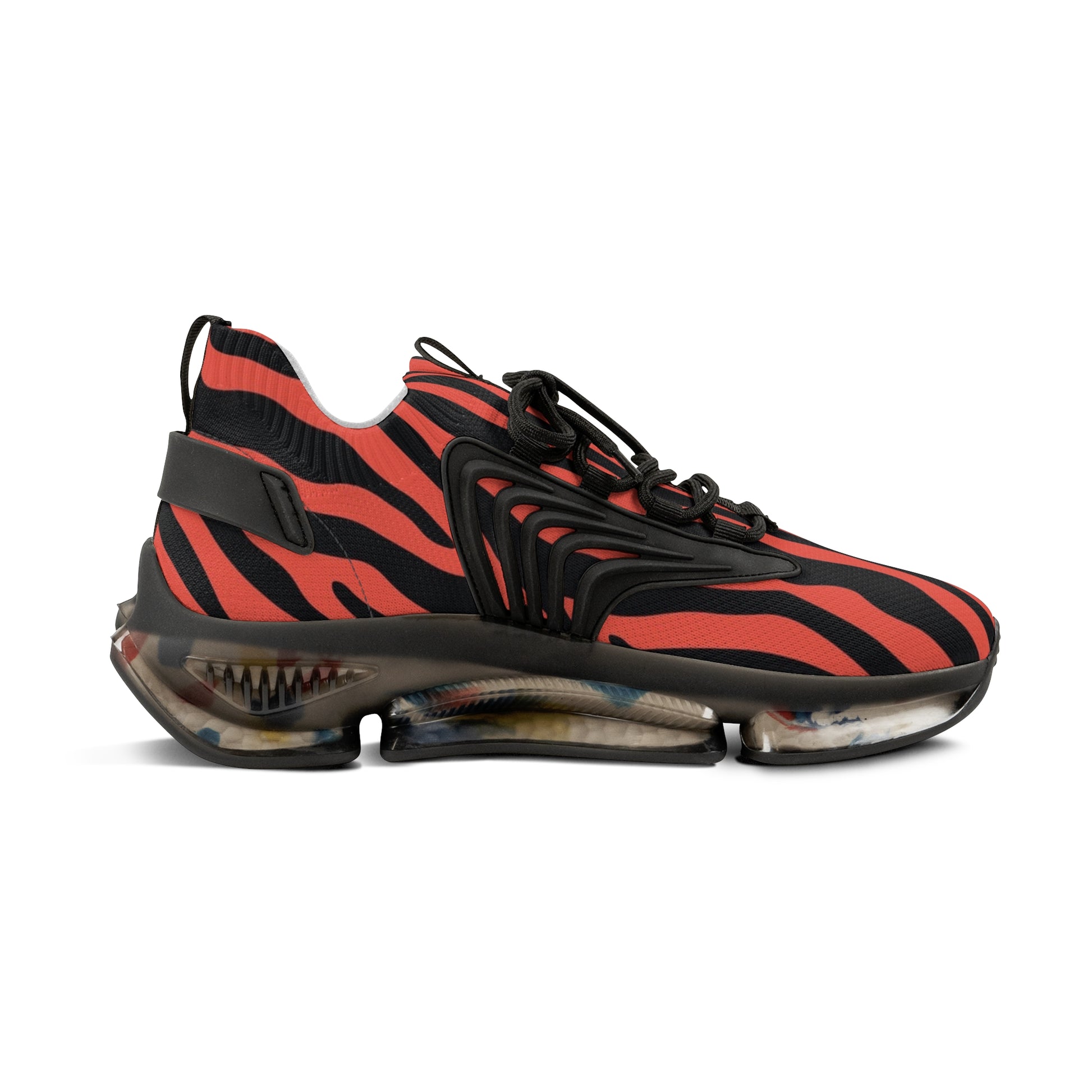 Side view of red and black zebra print sneakers with adjustable black strap and sole