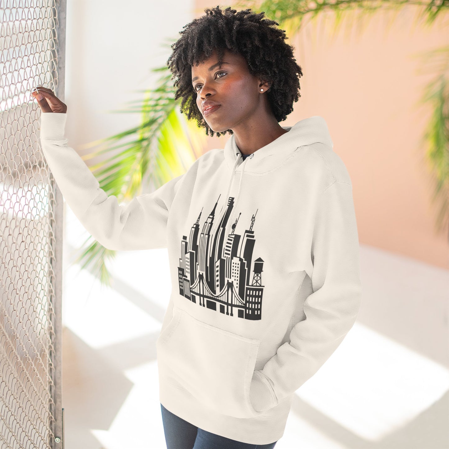 White unisex pullover hoodie with hood and city skyline bridge graphic