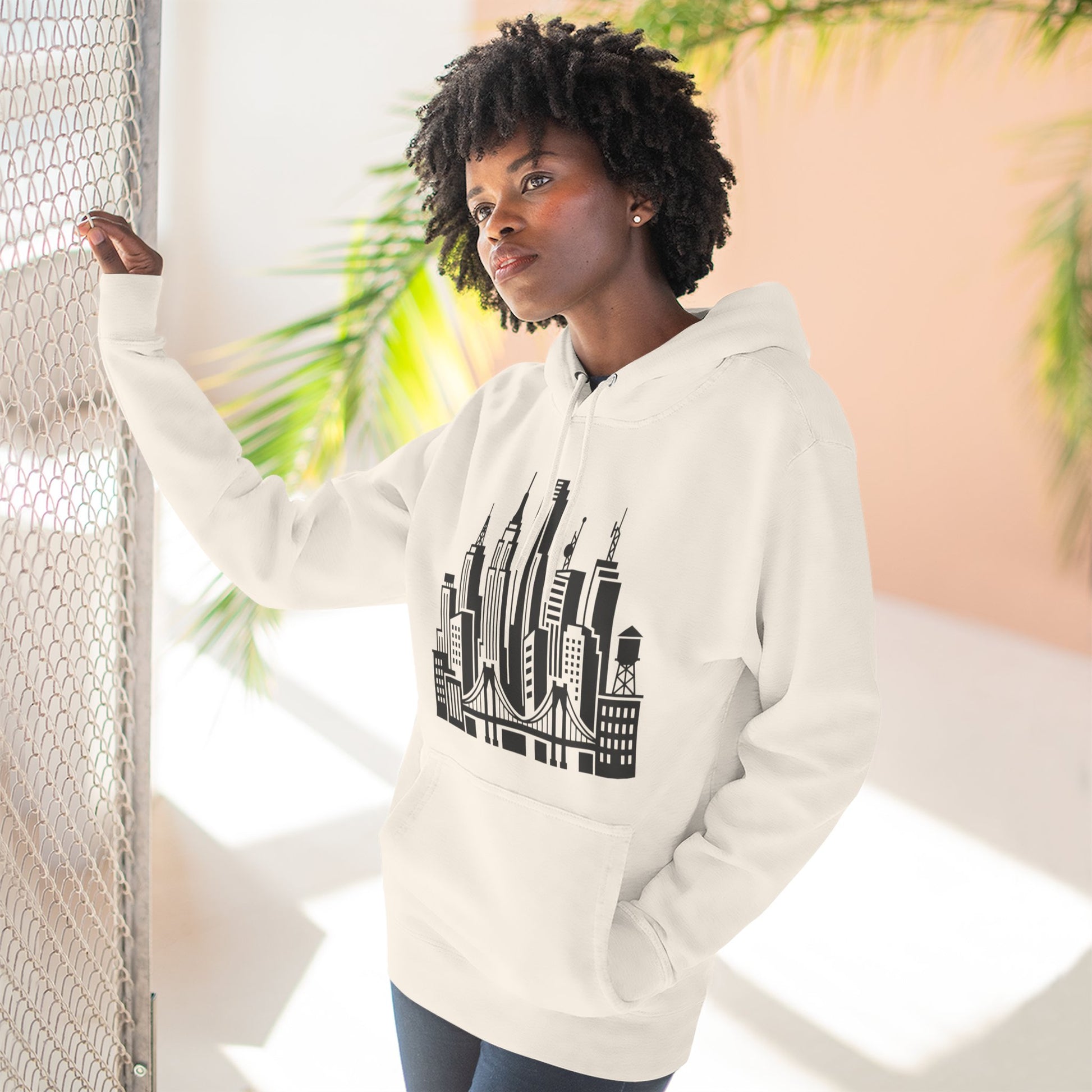 White unisex pullover hoodie with hood and city skyline bridge graphic