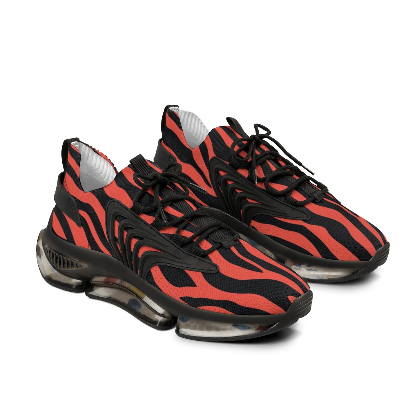Pair of red and black zebra print athletic sneakers with black laces and thick sole