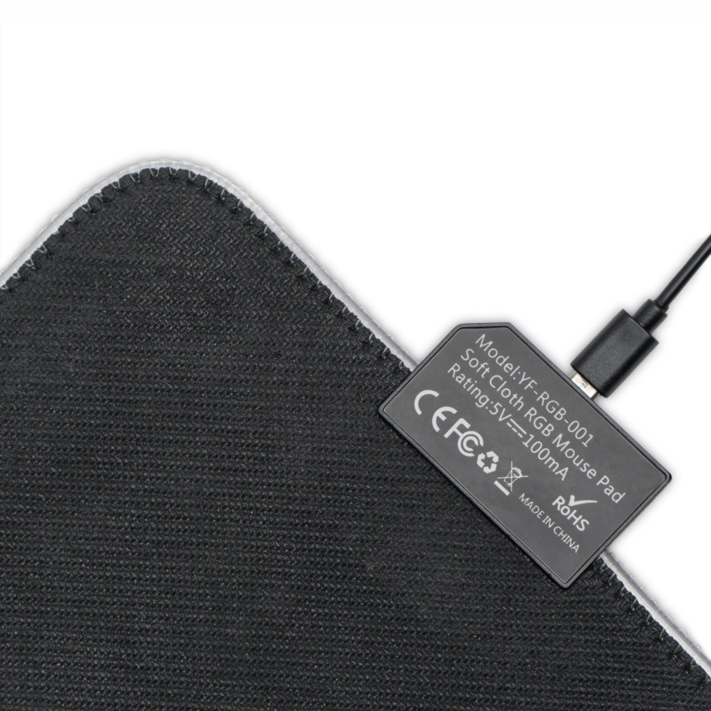 Black fabric underside of LED gaming mouse pad with USB connector label and stitched edge.