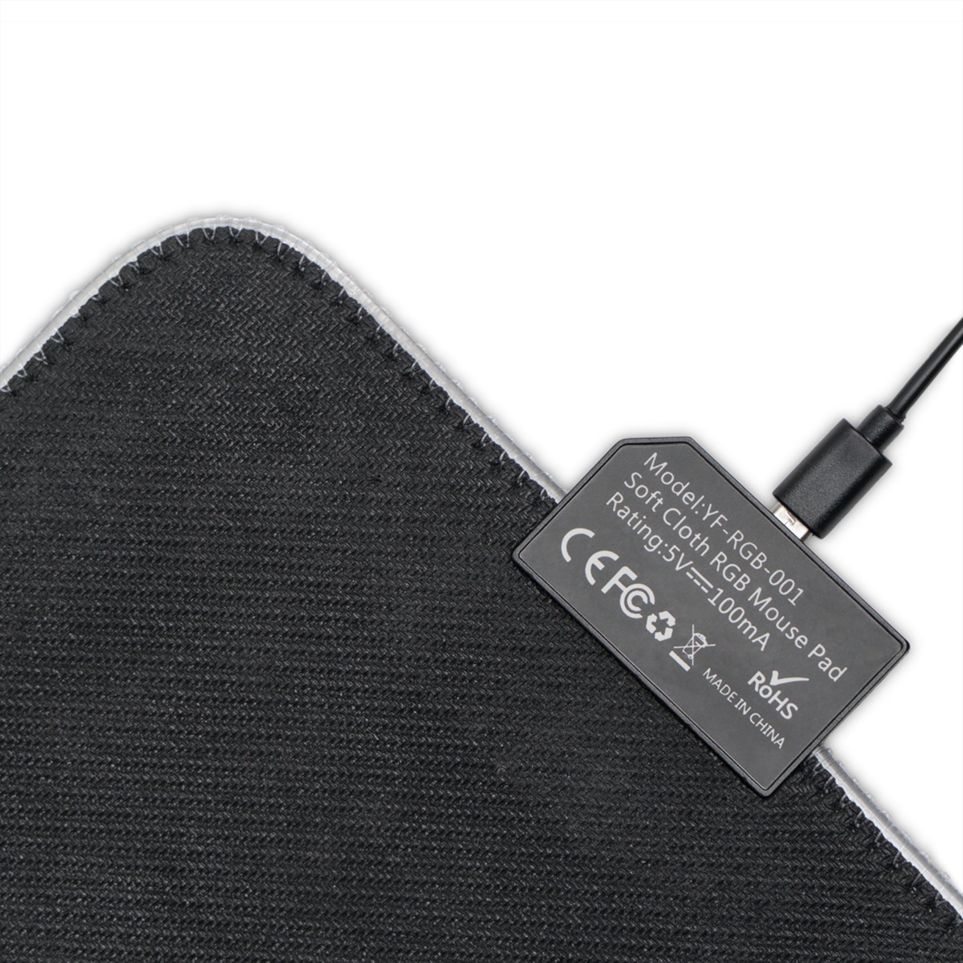 Black fabric underside of LED gaming mouse pad with USB connector label and stitched edge.