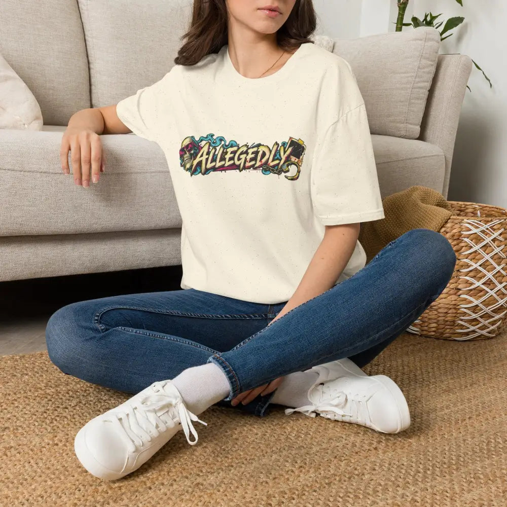 Cream-colored oversized unisex tee with colorful graffiti-style allegedly graphic and low heat tumble dry care instructions