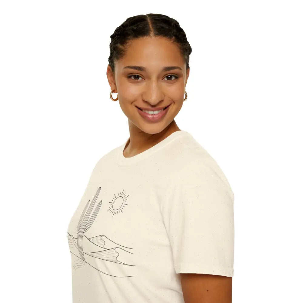 Cream-colored unisex t-shirt with desert landscape graphic, lightweight fabric, elastic ribbed collar