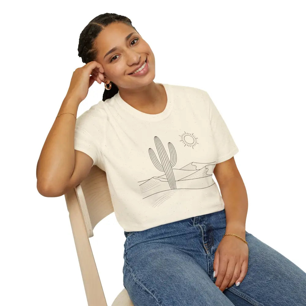 Women’s cream-colored unisex t-shirt with cactus and desert landscape graphic in lightweight fabric