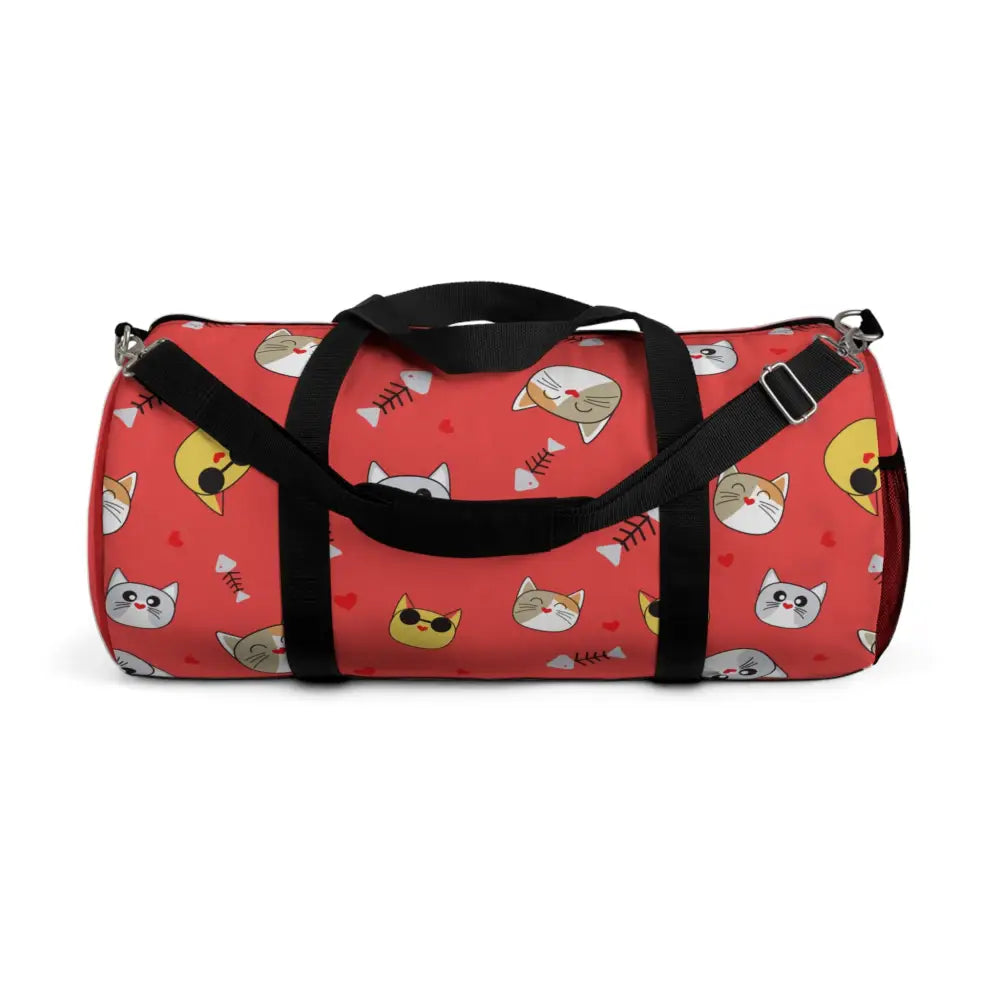 Red duffel bag with cat faces and fish skeleton pattern, perfect pet travel companion