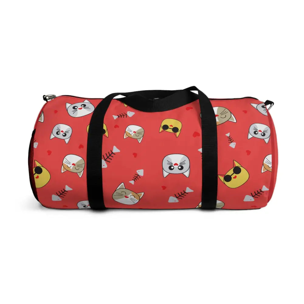 Red duffel bag with cartoon cat faces and fish skeletons, perfect pet travel companion