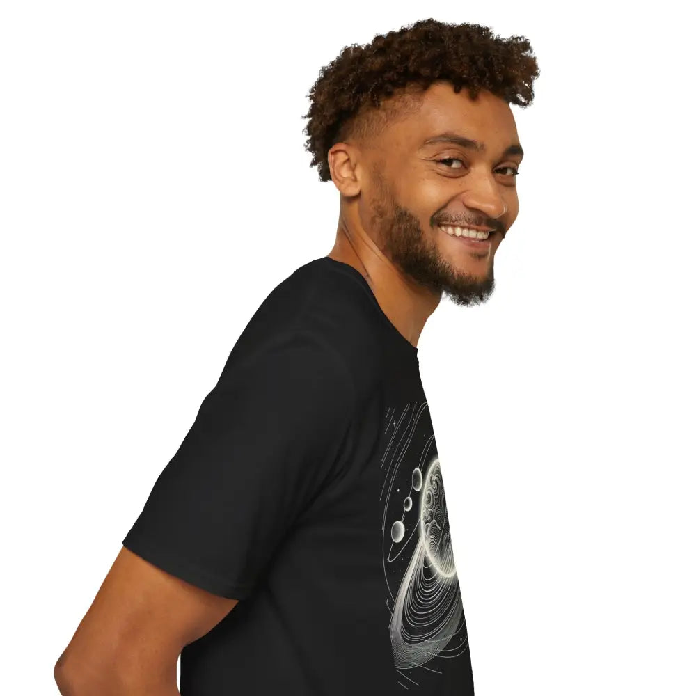 Smiling man in a black unisex softstyle t-shirt with mesmerizing cosmic design