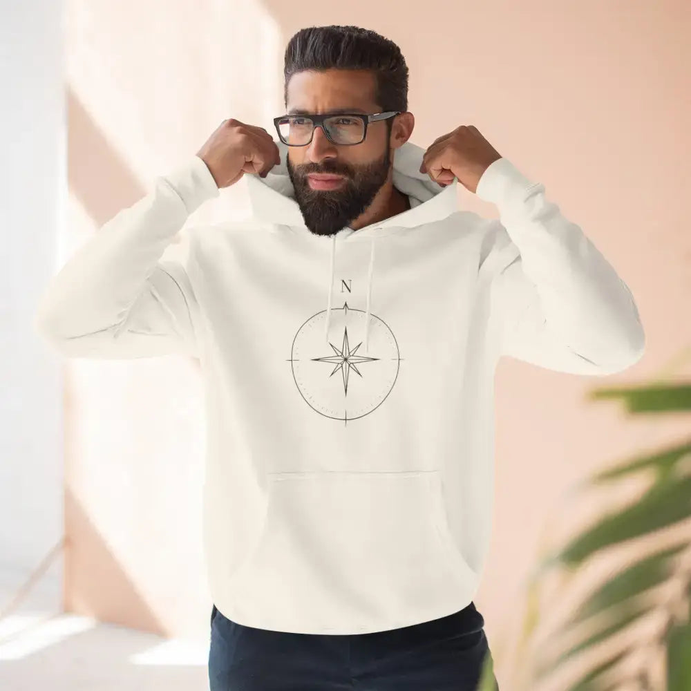 Cream-colored Cozy Compass Unisex Hoodie with adjustable hood and low heat fleece care
