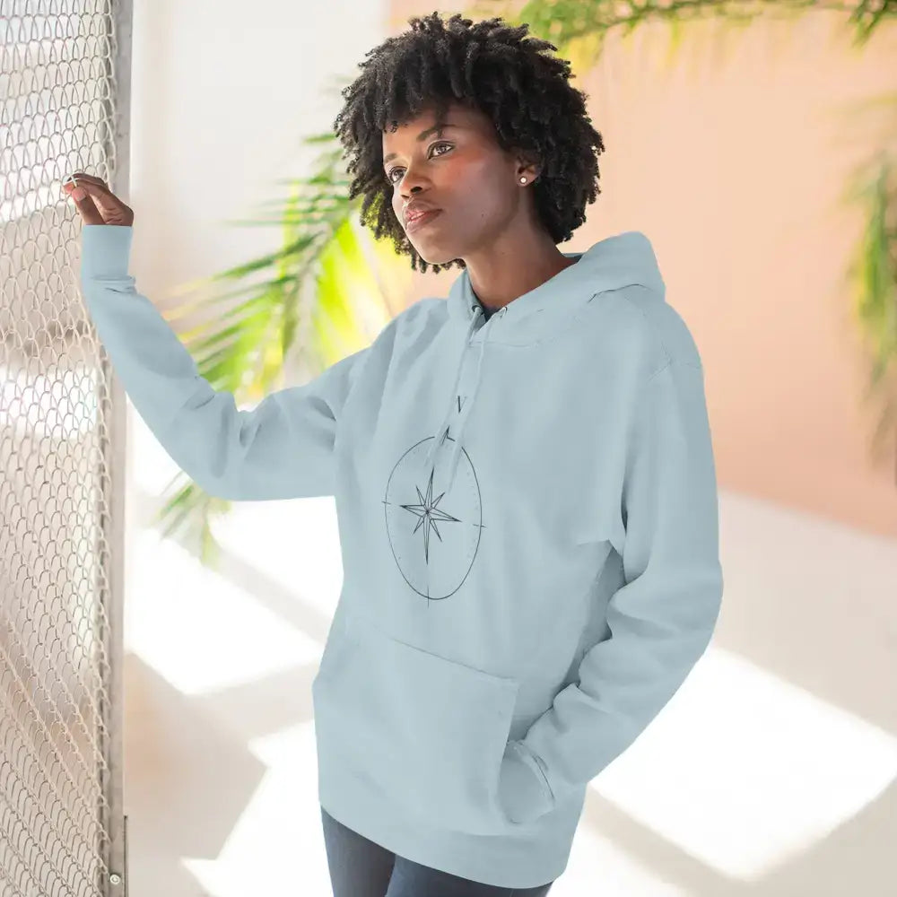Light blue cozy compass unisex fleece hoodie pullover with compass rose design for adventurers