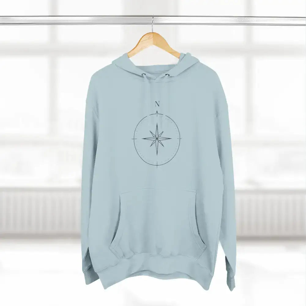 Light blue Cozy Compass Unisex Hoodie with adjustable hood and low heat fleece care