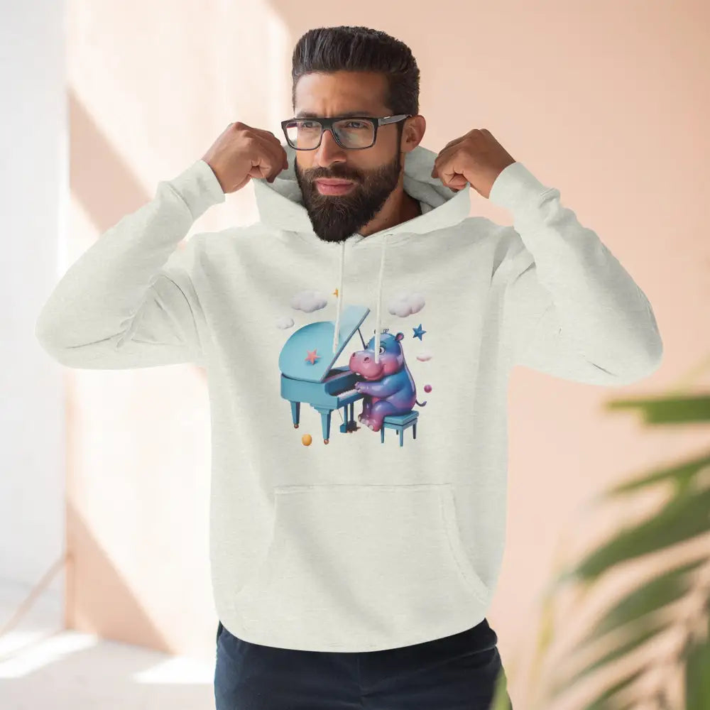 Man wearing a white fleece hoodie with a cartoon hippo playing piano, perfect for music lovers