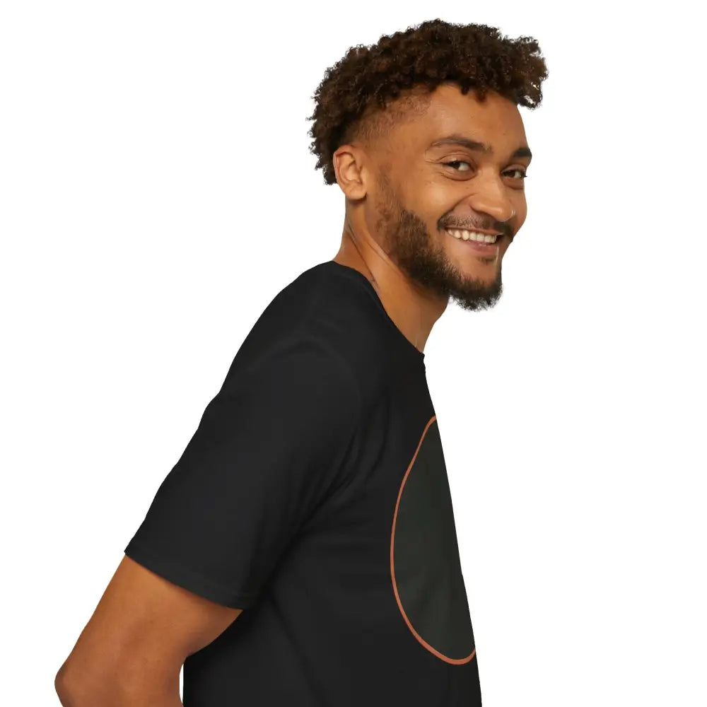 Smiling man wearing a black Dreamy Cat Graphic Unisex T-Shirt with rust-colored ring-spun cotton for cat lovers
