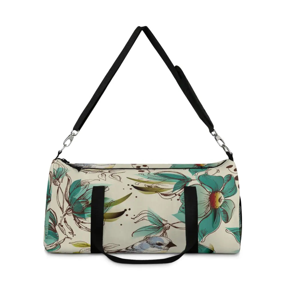 Cream-colored floral and bird pattern duffel bag with black handles, perfect travel companion