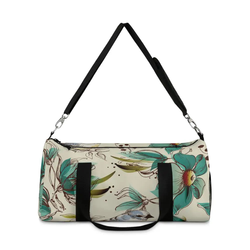 Floral print duffel bag with detachable shoulder strap and black handles, perfect travel companion