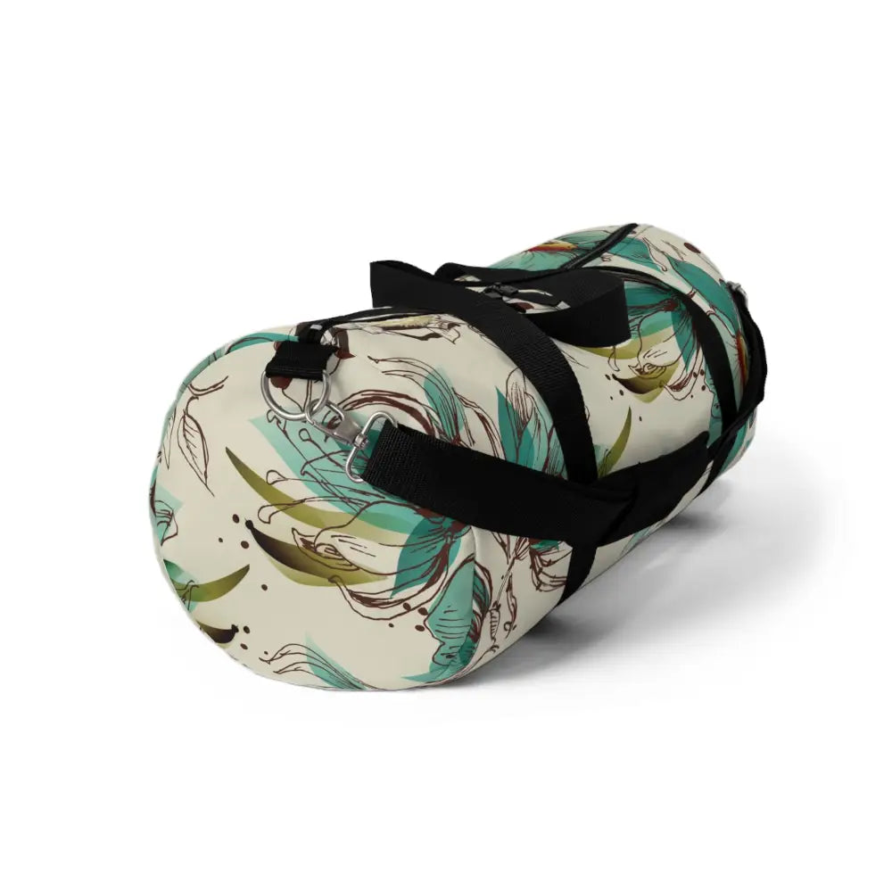 Cream-colored floral duffel bag with black straps, perfect travel companion with multiple compartments