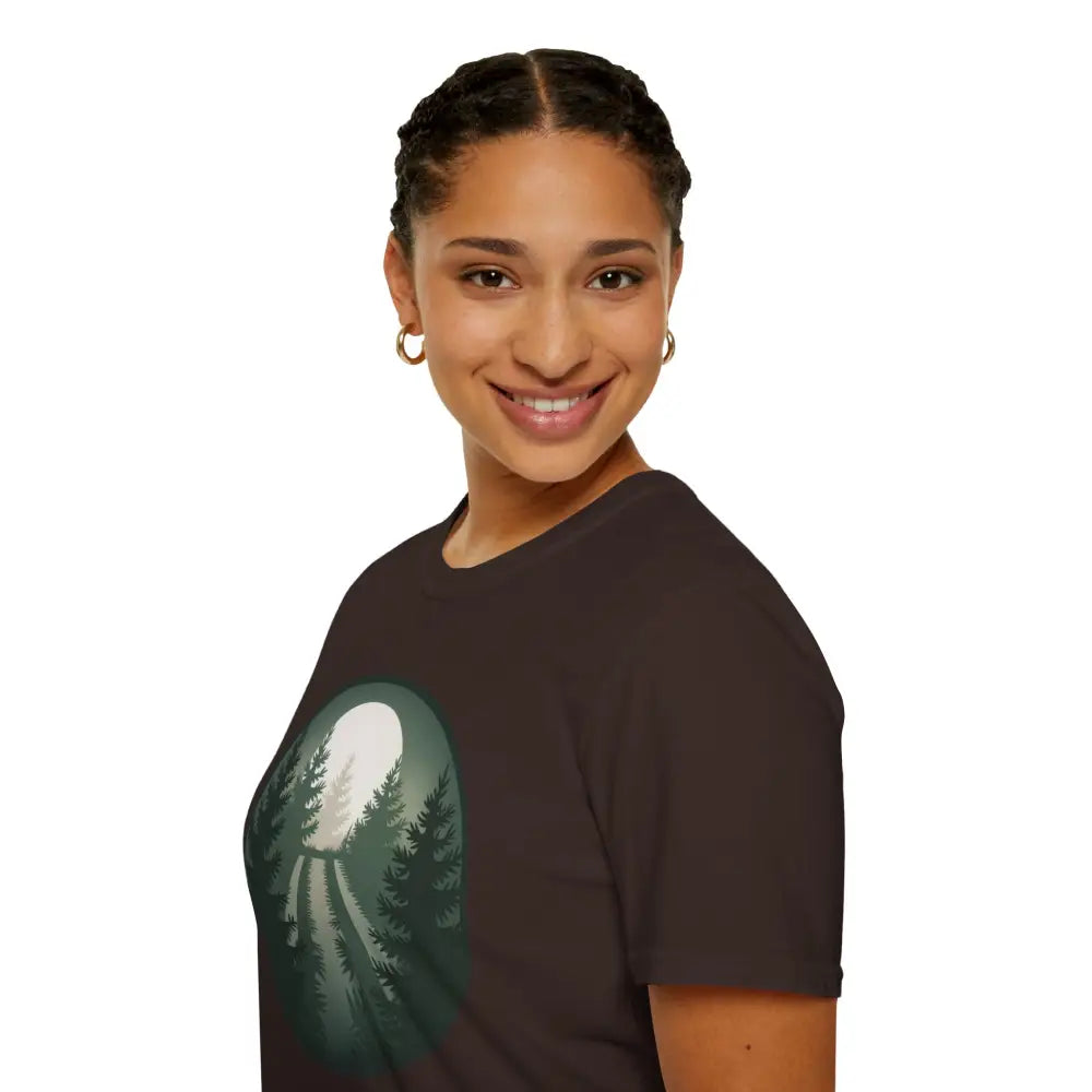Woman in a stunning unisex softstyle Forest Vibes T-Shirt with a forest and moon design
