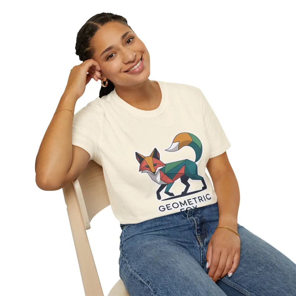 Woman wearing a cream-colored unisex softstyle t-shirt with a unique geometric fox design for Earth Day