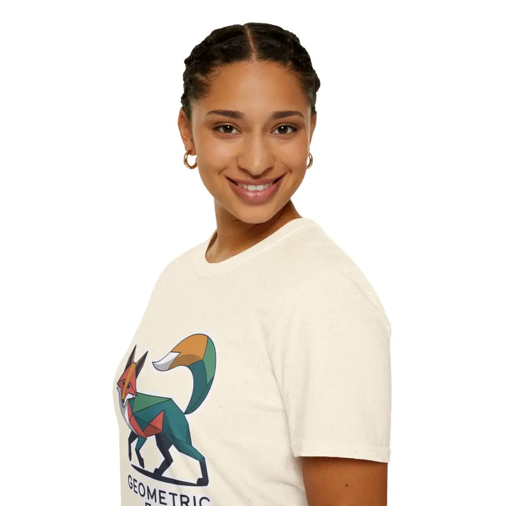 Woman in cream-colored unisex softstyle t-shirt with a unique geometric fox design for Earth Day