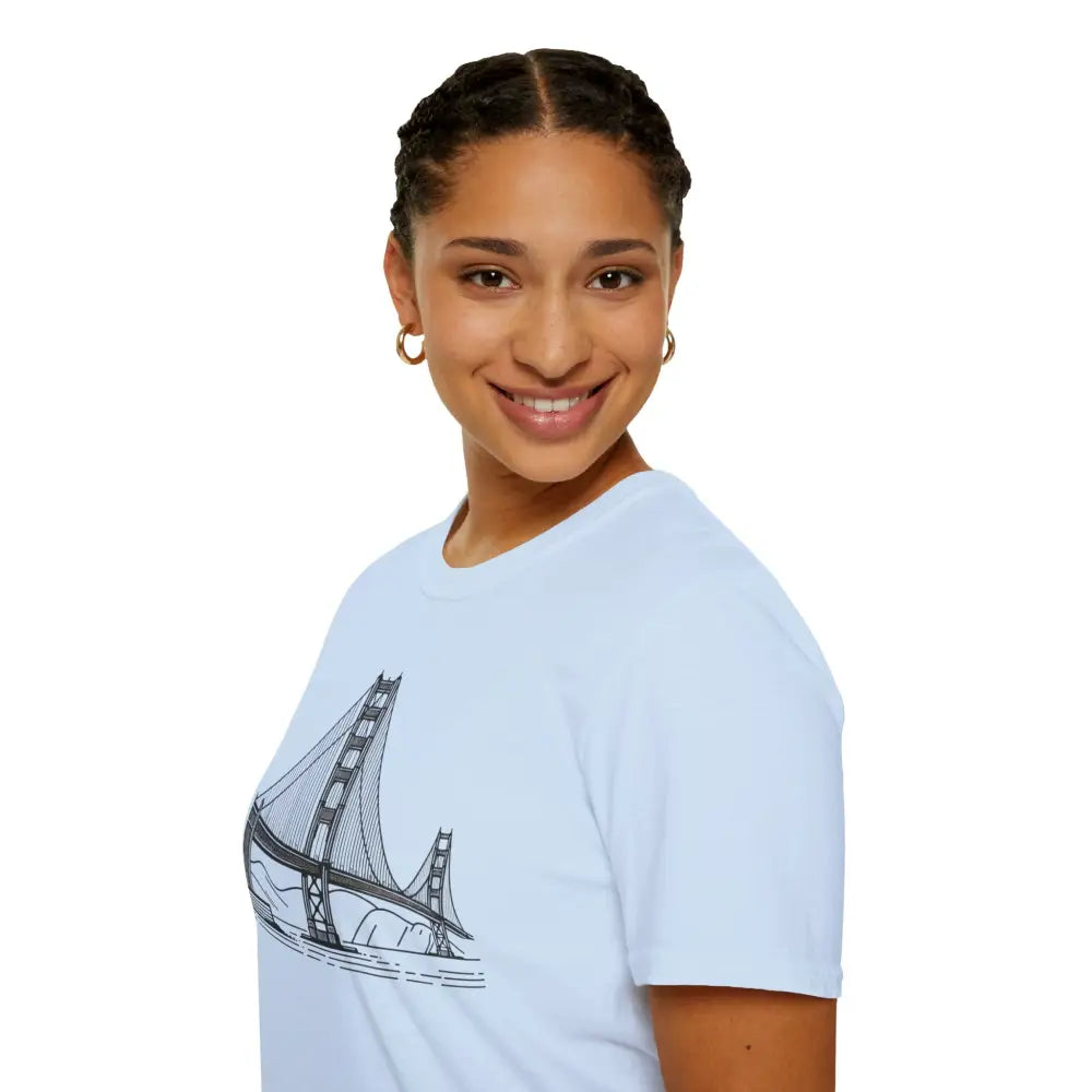 Young woman wearing light blue Golden Gate Bridge unisex softstyle t-shirt with seamless design reduces fabric waste