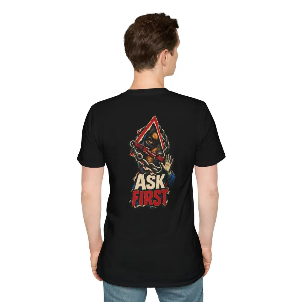 Black short-sleeved unisex t-shirt with a doberman graphic breaking through a red frame and ask first text low heat care