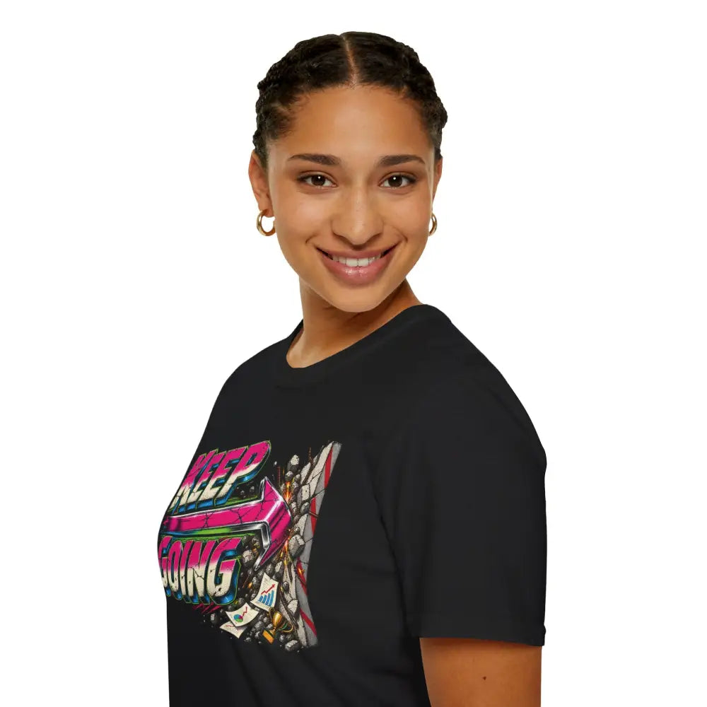Black keep going unisex t-shirt with neon pink blue and white robot graphic low heat tumble dry care instructions