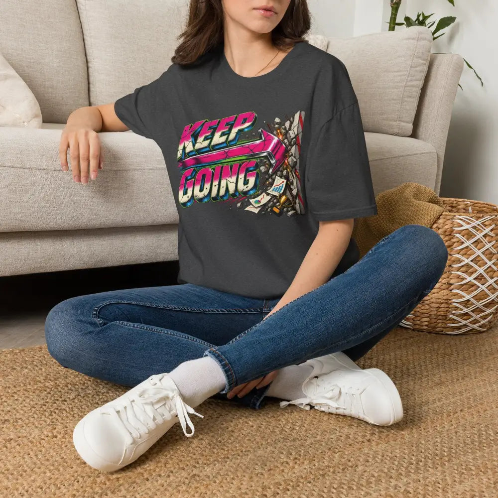 Dark gray keep going unisex t-shirt with vibrant retro pink and blue neon graphic, low heat tumble dry care instructions
