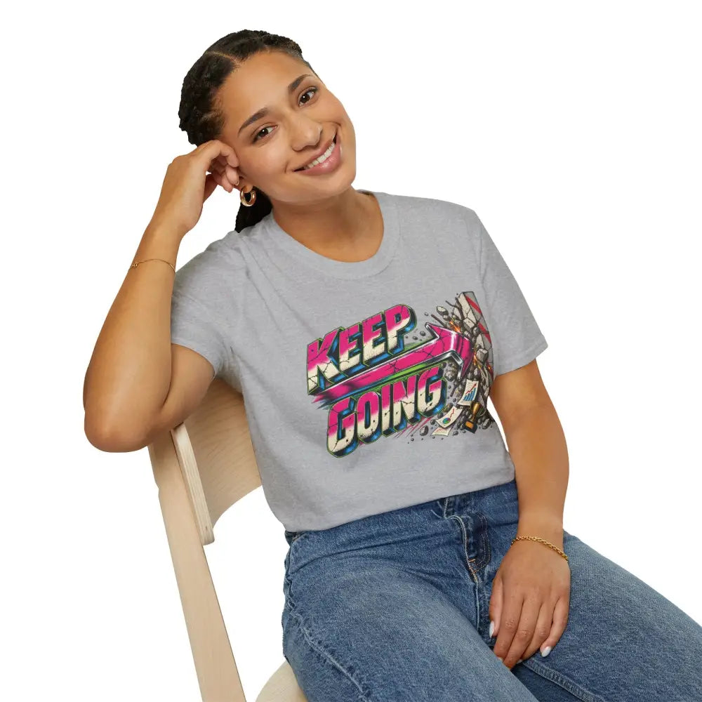 Gray cotton keep going unisex t-shirt with vibrant pink green and black graphic and care instructions for low heat tumble dry