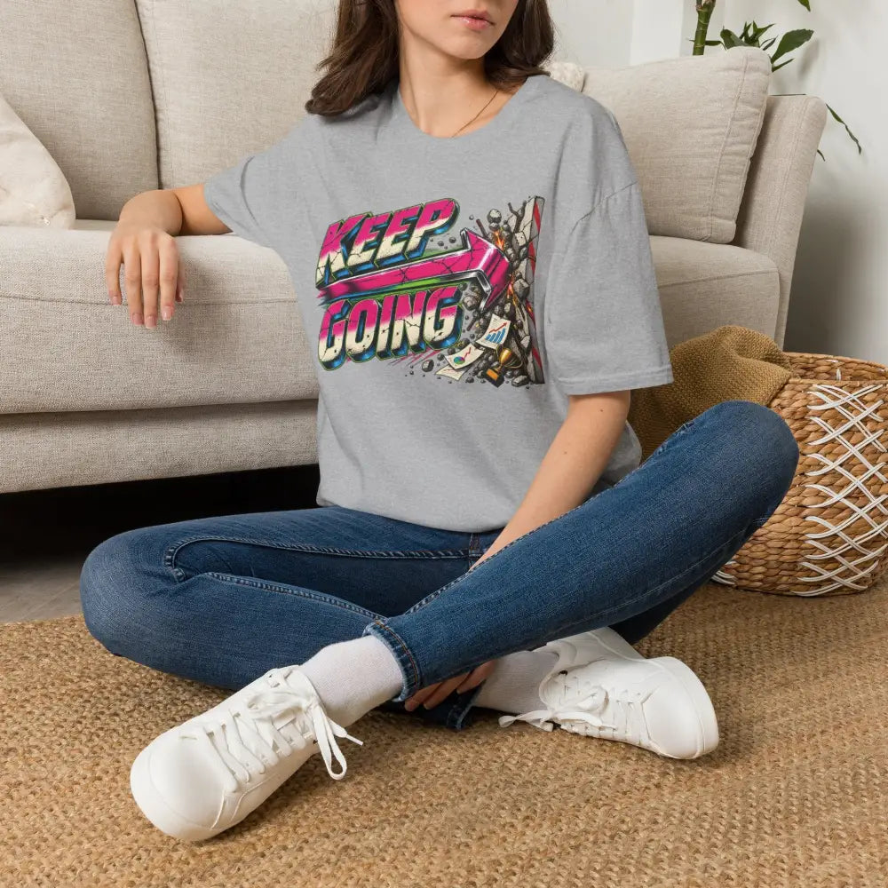 Gray cotton keep going unisex t-shirt with colorful retro graphic design and care instructions low heat tumble dry