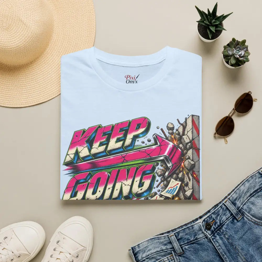 Light blue cotton keep going unisex t shirt with vibrant graffiti graphic and arrow bursting brickwork low heat tumble dry care instructions