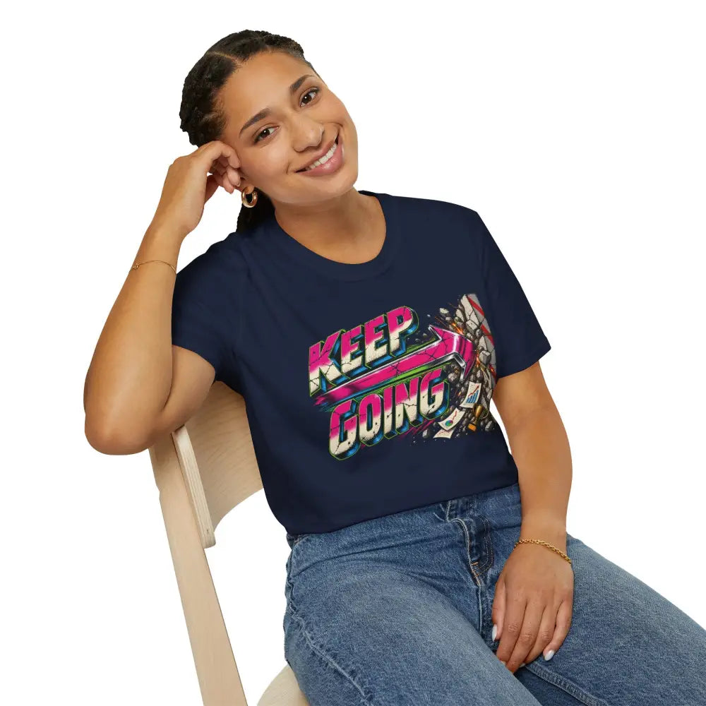 Navy blue unisex short-sleeved t-shirt with vibrant keep going neon graphic and care instructions for low heat tumble dry