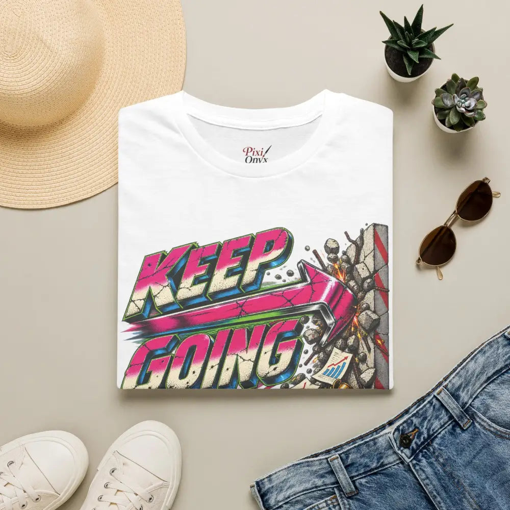 White cotton keep going unisex t-shirt with vibrant graffiti graphic featuring pink and blue lettering care instructions low heat tumble dry