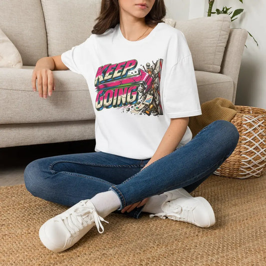 White cotton keep going unisex t-shirt with bold pink purple teal graphic and care instructions low heat tumble dry