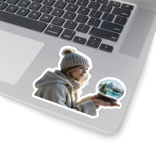 Laptop sticker featuring a woman holding a snow globe from PixiOnyx Winter Wonder series