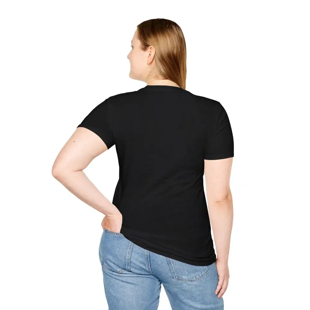 Woman in black t-shirt and blue jeans wearing Lotus Blossom Unisex Softstyle T-Shirt for yoga and mindfulness