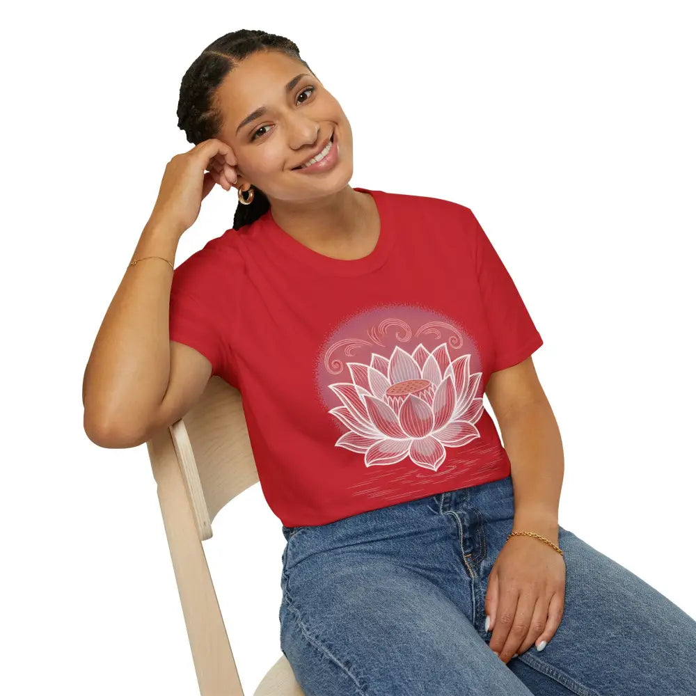 Woman in red lotus flower unisex softstyle t-shirt and jeans, enhancing aesthetic appeal