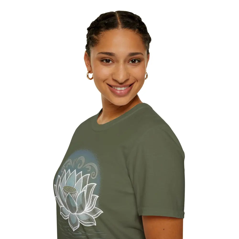Woman wearing a green lotus blossom unisex softstyle t-shirt promoting mindfulness and reducing fabric waste