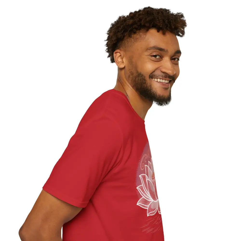 Smiling man in a red unisex softstyle t-shirt with white lotus design, enhancing aesthetic appeal