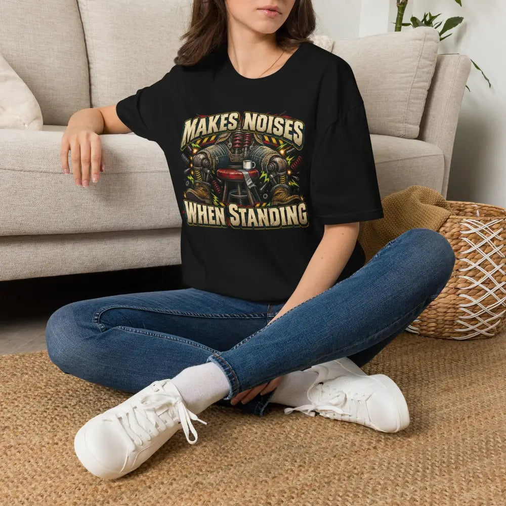 Black short-sleeved makes noises when standing unisex t-shirt with vintage mechanical print low heat tumble dry care instructions