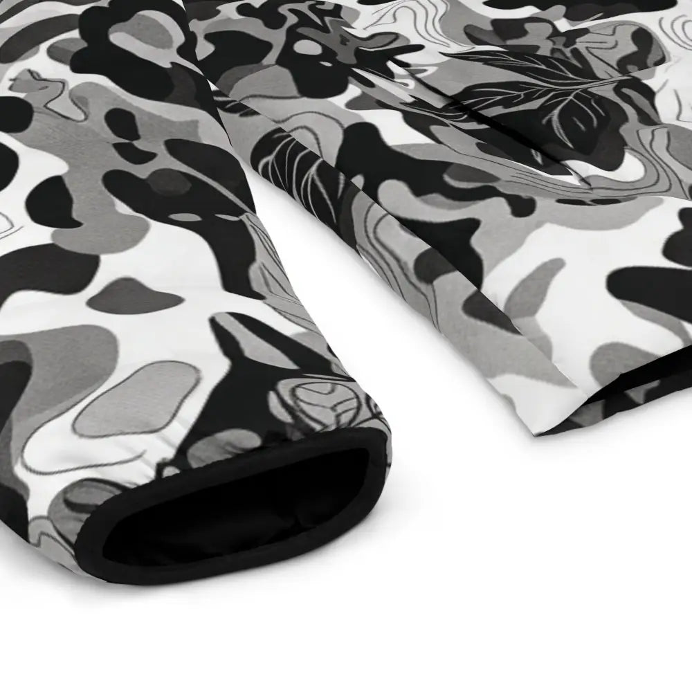 Men’s monochrome leaf camo puffer jacket sleeve with black gray abstract camouflage pattern and soft plush lining brings urban edge