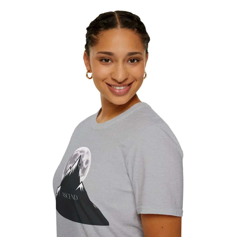 Woman in a light gray mountain and moon graphic T-shirt, machine washable, low heat dry