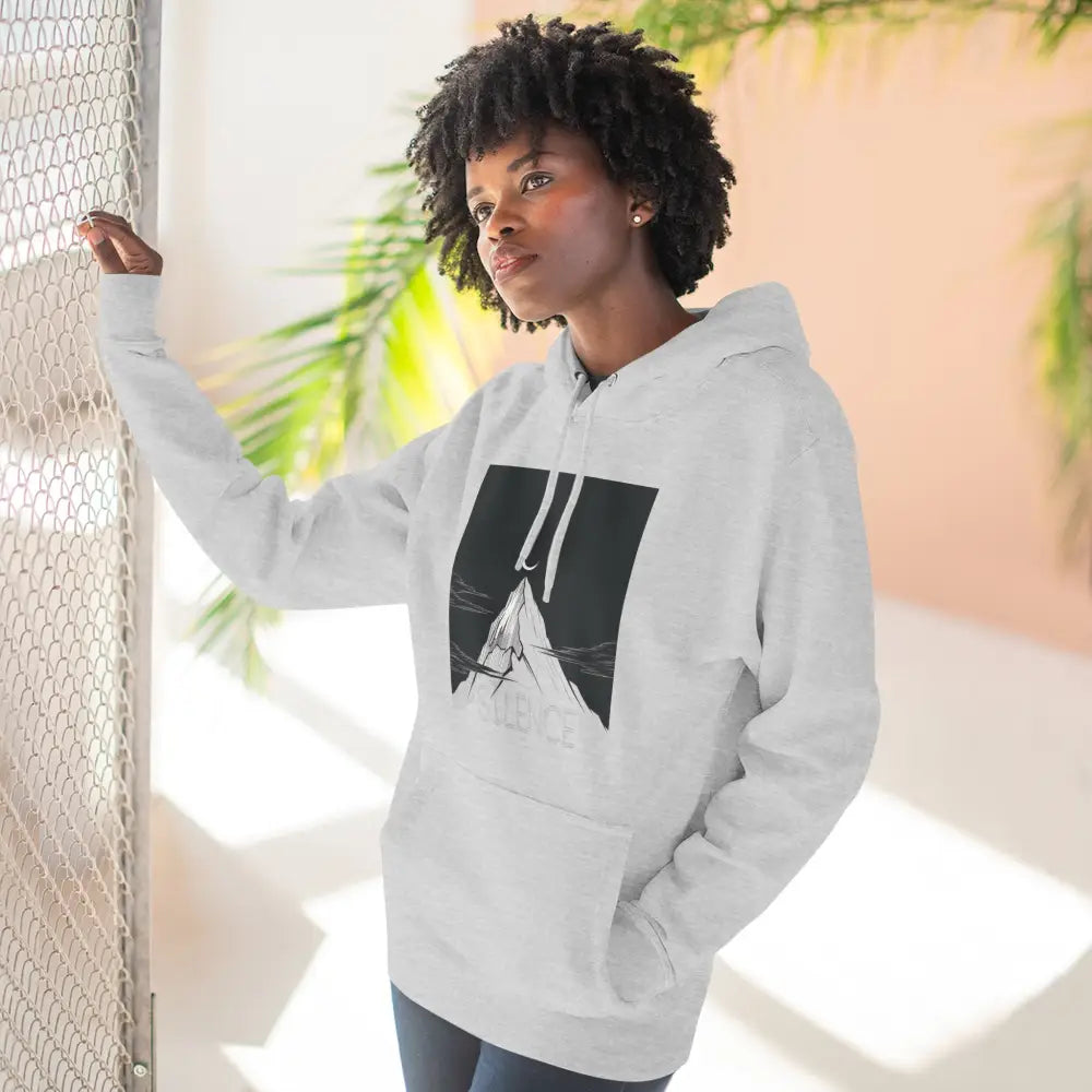 Woman wearing Mountain Vibes Fleece Unisex Hoodie with mountain graphic and cozy fit