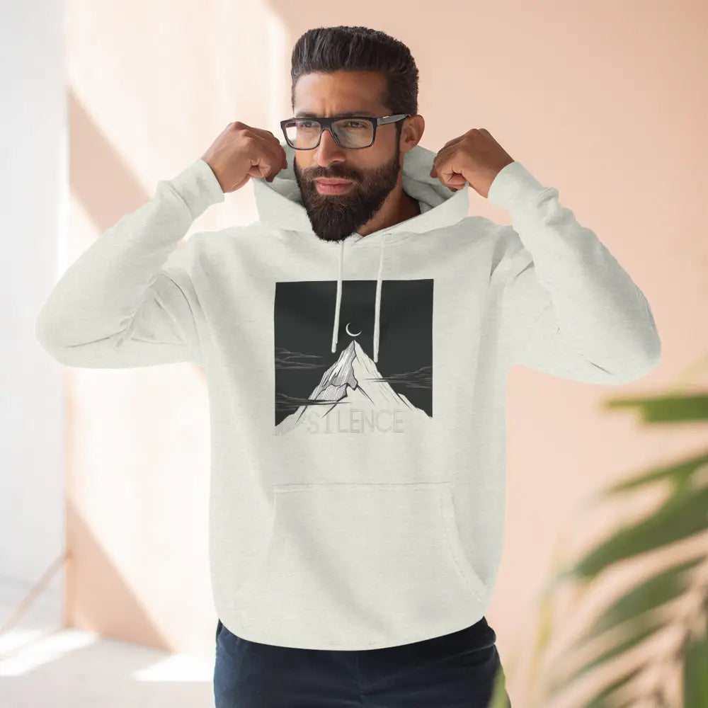 Man wearing mountain vibes fleece unisex hoodie with mountain moon graphic and SILENCE print