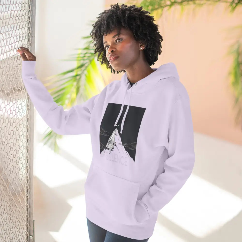 Young woman in Mountain Vibes Fleece Unisex Hoodie with graphic mountain design
